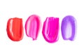 Cosmetic texture smudge pink, red, purple liquid lipstick. Swatches isolated on white. A smears of lipstick or nail polish