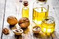 Cosmetic and therapeutic walnut oil on wooden background