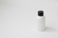 Cosmetic white bottle on white background. Cosmetic packaging for the collection of creams, oils, balms, shampoos Royalty Free Stock Photo