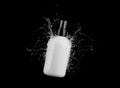 Cosmetic white bottle in water splash isolated on black background 3D render, hair and bory care products packaging and Royalty Free Stock Photo