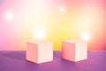 Cosmetic yellow pink lilac gradient background with lens flare effect. Two white cubic podiums. Mockup for the