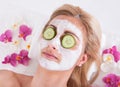 Cosmetician applying facial mask on face of woman Royalty Free Stock Photo