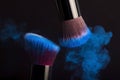 Cosmetics brush and colorful makeup powder Royalty Free Stock Photo