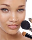 Cosmetics, brushes and portrait of young woman in studio for beauty, foundation and makeup. Closeup face of model