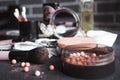 Cosmetics on a dark background, close-up. Face care, make-up. Items for applying makeup. The world of a woman