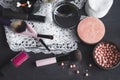 Cosmetics on a dark background, close-up. Face care, make-up. Items for applying makeup. The world of a woman Royalty Free Stock Photo