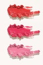 Cosmetics lipstick swatches. Peach, pink, red and coral toned styled cosmetics flat lay. Closeup colour palette Royalty Free Stock Photo