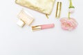 Cosmetics for make-up pink with gold on a white background. Copy