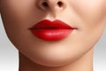 Cosmetics, makeup. Bright lipstick on lips. Closeup of beautiful female mouth with red lip makeup. Clean skin model Royalty Free Stock Photo