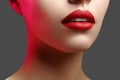 Cosmetics, makeup. Bright lipstick on lips. Closeup of beautiful female mouth with red lip makeup. Clean skin model Royalty Free Stock Photo