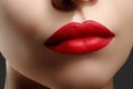 Cosmetics, makeup. Bright lipstick on lips. Closeup of beautiful female mouth with red lip makeup. Clean skin model Royalty Free Stock Photo