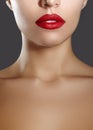 Cosmetics, makeup. Bright lipstick on lips. Closeup of beautiful female mouth with red and red lip makeup. Part of face Royalty Free Stock Photo
