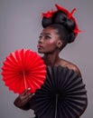 Cosmetics, makeup and origami with black woman in studio for creative, art and culture. Traditional, beauty and paper Royalty Free Stock Photo