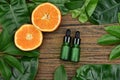 Cosmetics skincare with vitamin-c extract, Cosmetic dropper bottle containers with fresh orange slices.