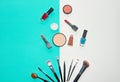 Cosmetics white and blue background with make up artist objects: lipstick, eye shadows, mascara ,eyeliner, concealer, nail polish. Royalty Free Stock Photo