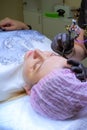 Cosmetologist applying permanent makeup on eyebrows Selective focus and shallow Depth of field.Mikrobleyding eyebrows Royalty Free Stock Photo