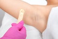 The cosmetologist does laser hair removal on the armpits, she applies the gel to the skin. Laser hair removal and cosmetology. The Royalty Free Stock Photo