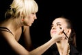 Cosmetologist doing make-up