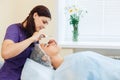 The cosmetologist makes the apparatus a procedure of ultrasound cleaning of skin Royalty Free Stock Photo