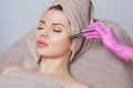 The cosmetologist makes the procedure Microdermabrasion of the face skin of a beautiful woman in a beauty salon.Cosmetology and Royalty Free Stock Photo