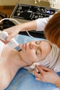 The cosmetologist makes the procedure ultrasonic face