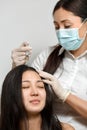 Cosmetologist procedure of mesotherapy