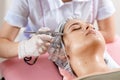 cosmetology beauty clinic.Professional cosmetologist conducts cell oxygenation for the face Ozone treatment with Royalty Free Stock Photo