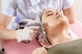 cosmetology beauty clinic.Professional cosmetologist conducts cell oxygenation for the face Ozone treatment with Royalty Free Stock Photo