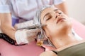 cosmetology beauty clinic.Professional cosmetologist conducts cell oxygenation for the face Ozone treatment with