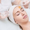 Cosmetology beauty procedure. Young woman skin care. Royalty Free Stock Photo