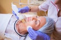 Cosmetology doctor makes the procedure a woman face cleaning Royalty Free Stock Photo