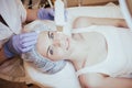 Cosmetology doctor makes the procedure a woman face cleaning Royalty Free Stock Photo