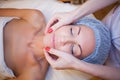 Cosmetology doctor makes woman treatments facial massage