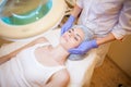 Cosmetology doctor makes woman treatments facial massage