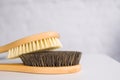 Cosmetology, grooming, spa, beauty, cellulite and bikini concept. close up two wooden soft massage brushes for body and legs. spac