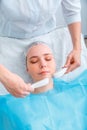 Microcurrents Cosmetology procedure. Beauty Doctor cosmetologist doing aesthetics facial therapy microcurrents