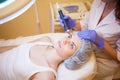 Cosmetology Spa woman doing procedures on the face Royalty Free Stock Photo