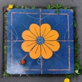 Cosmic Symbolism in Orange Flower and Square on Blue Canvas (AI Generated) Royalty Free Stock Photo
