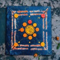 Cosmic Symbolism in Orange Flower and Square on Blue Canvas (AI Generated) Royalty Free Stock Photo