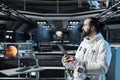 Cosmonaut in orbital station verifying navigation coordinates to Mars Royalty Free Stock Photo