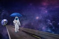 Cosmonaut space walk under an umbrella from planet Earth to the universe