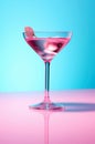 Cosmopolitan alcoholic cocktail on blue background.