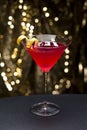 Cosmopolitan cocktail with lemon garnish