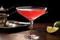 Cosmopolitan cocktail A pink cocktail with a lemon wedge on the side Royalty Free Stock Photo