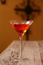 Cosmopolitan drink with oof cross in background Royalty Free Stock Photo