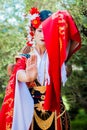 Cosplay. beautiful, modest geisha in a red kimono Royalty Free Stock Photo