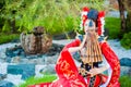 Cosplay. beautiful, modest geisha in a red kimono Royalty Free Stock Photo