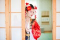 Cosplay. beautiful, modest geisha in a red kimono Royalty Free Stock Photo