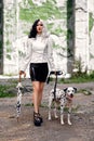 Cosplay on Cruella de Vil with a Dalmatian