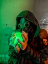 Cosplay of a stalker in a plague doctor mask holding a mysterious luminous artifact. art photo Royalty Free Stock Photo